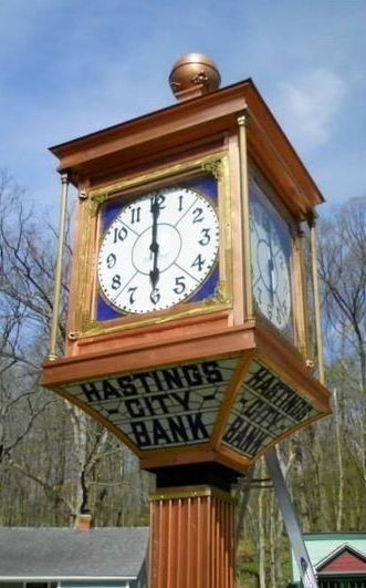 Large copper outdoor pedestal clock that once hung outside the Hastings City Bank. 
