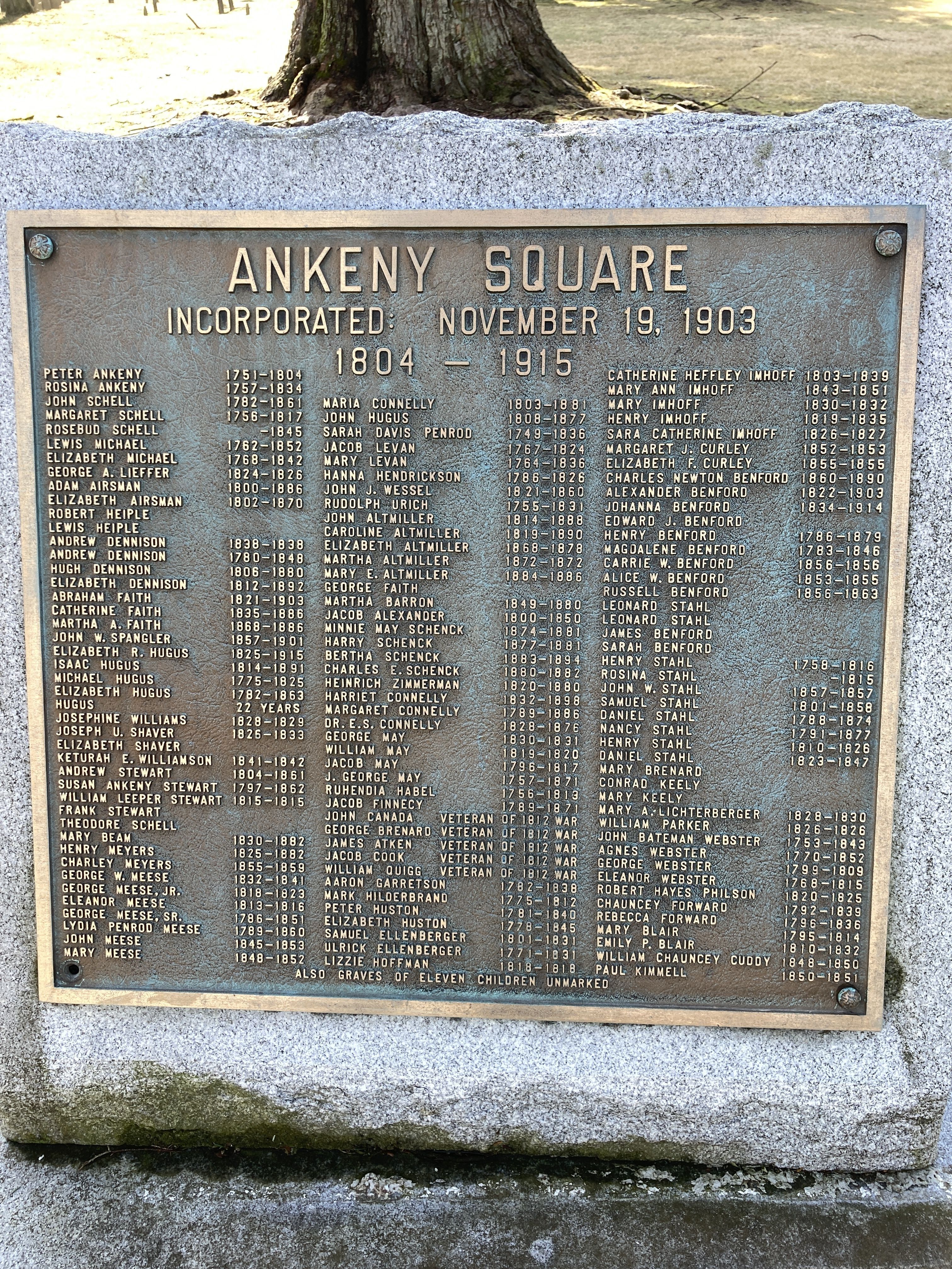 Bronze plaque listing the names of individuals buried in the Ankeny Square Cemetery