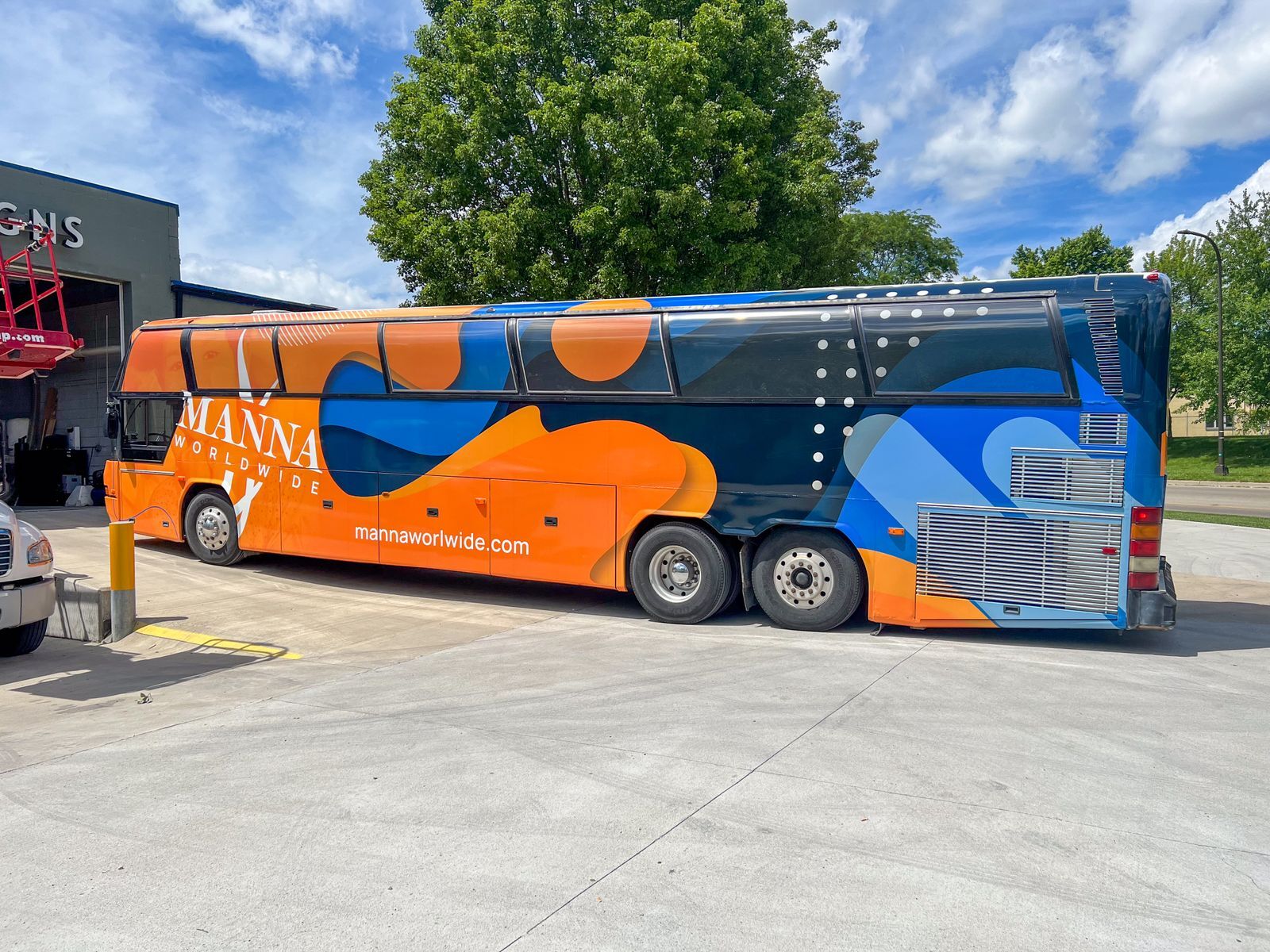 Coach bus with full vinyl wrap and custom design 