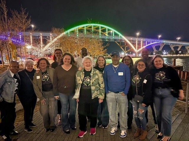 Community Advocates staff in front of the Hoan Bridge