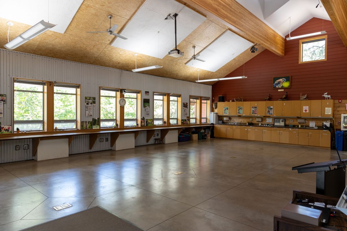 An image taken inside the Red Barn facing the back of the room, showing the open floor plan and many cabinets.