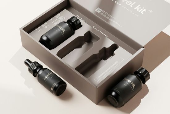 Matte black shampoo and conditioner travel bottles set in a custom-molded rigid box, a creative packaging design solution for cosmetic travel kits