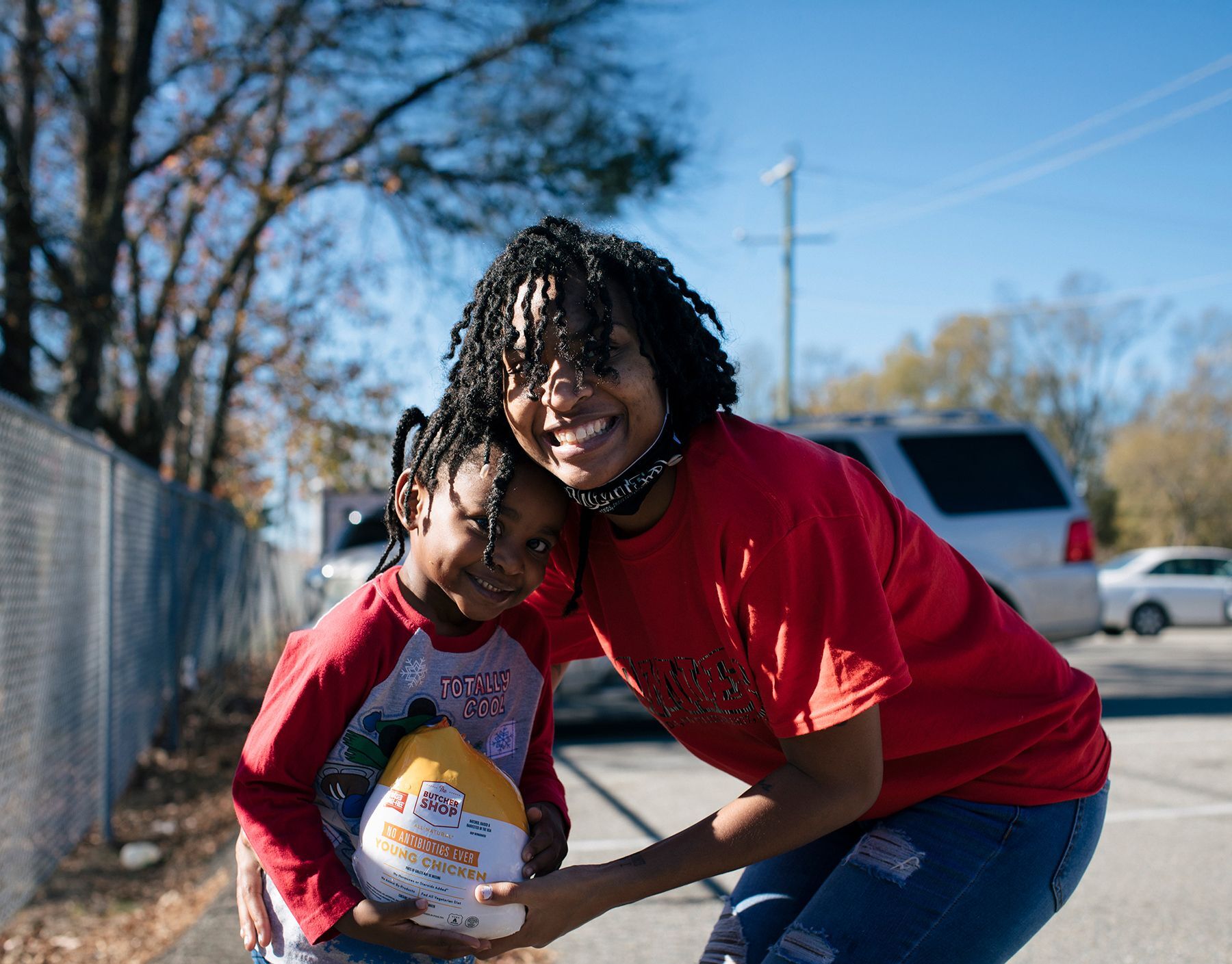 Mom and daughter receiving food