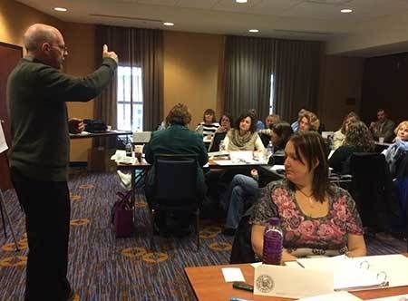 Presenter speaking to a group of nurses.