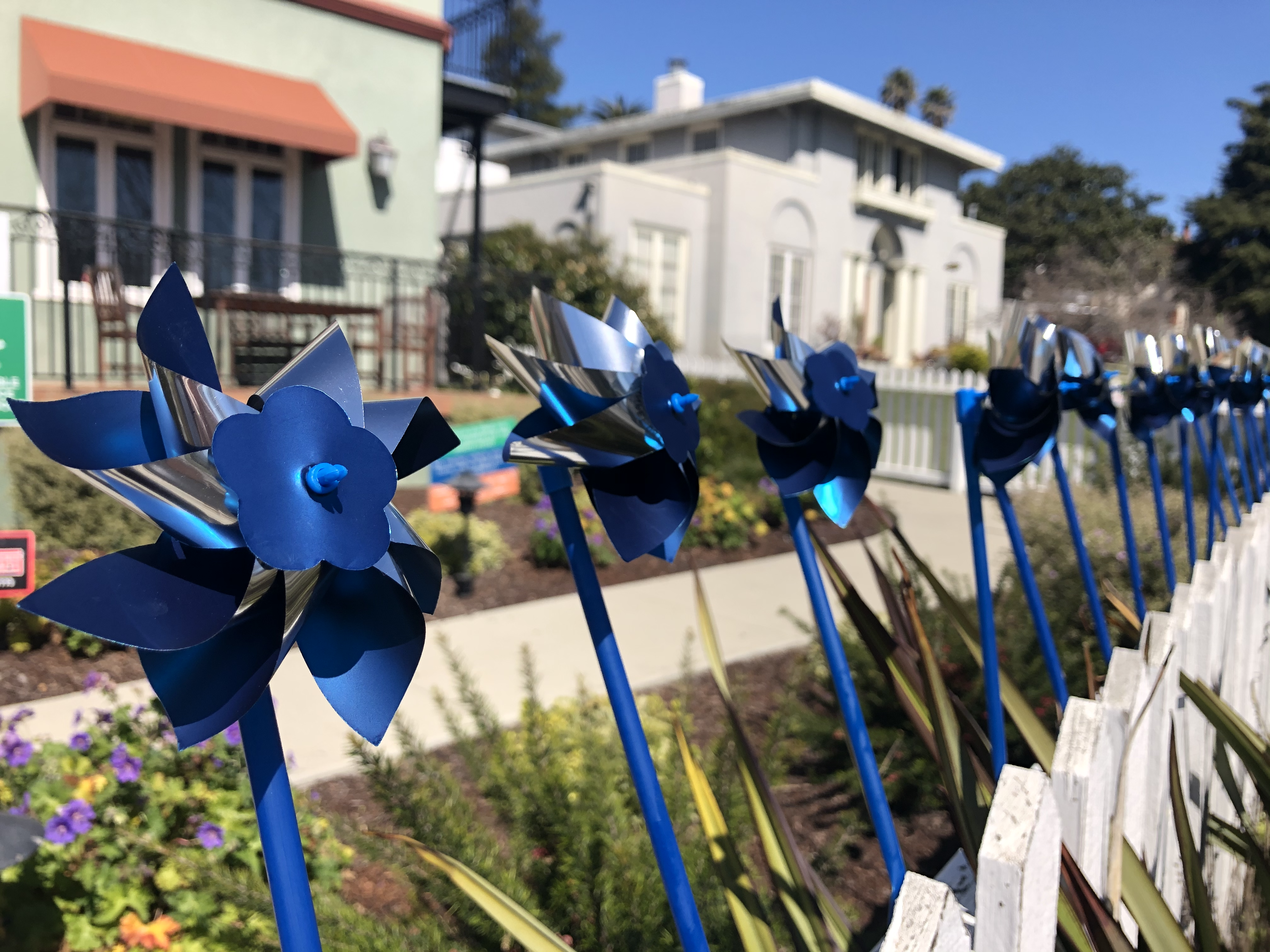 Pinwheels on a fence