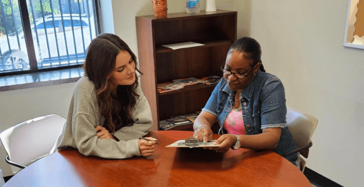 A case manager at Home for Families meets with a client to help them find housing