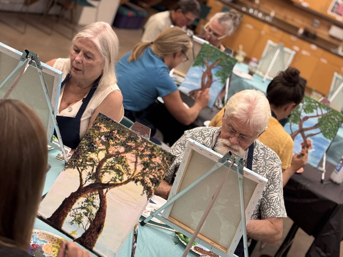 Picture of community doing a paint & sip event in the Red Barn.