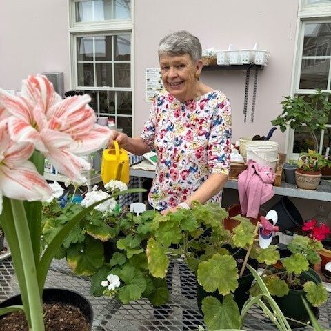 Doris Cronin in the Coburg Village Greenhouse