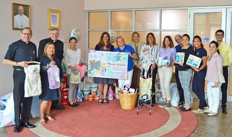 Pastoral staff donate to Walking with Moms in Need