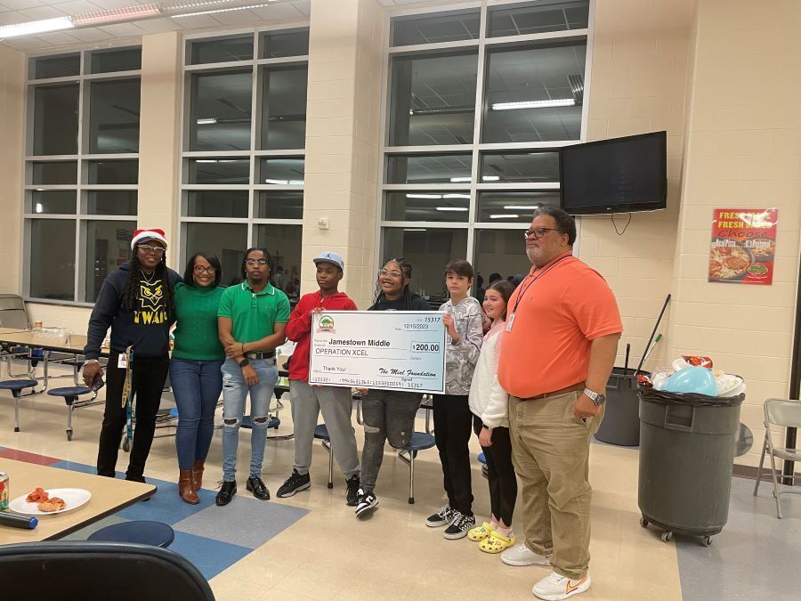 Operation Xcel's Operation Homework, an afterschool academic enrichment program at Jamestown Middle Schools received a donation from the Mial Foundation during the JTMS Winter Showcase