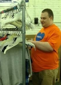 Picture of man working, wearing orange shirt