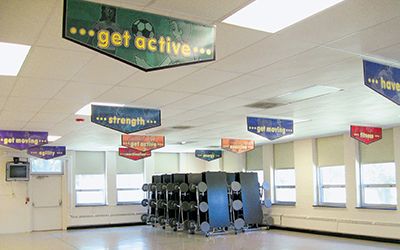 School café with 11 banners hanging from ceiling, custom banners, encourage healthy lifestyles in kids