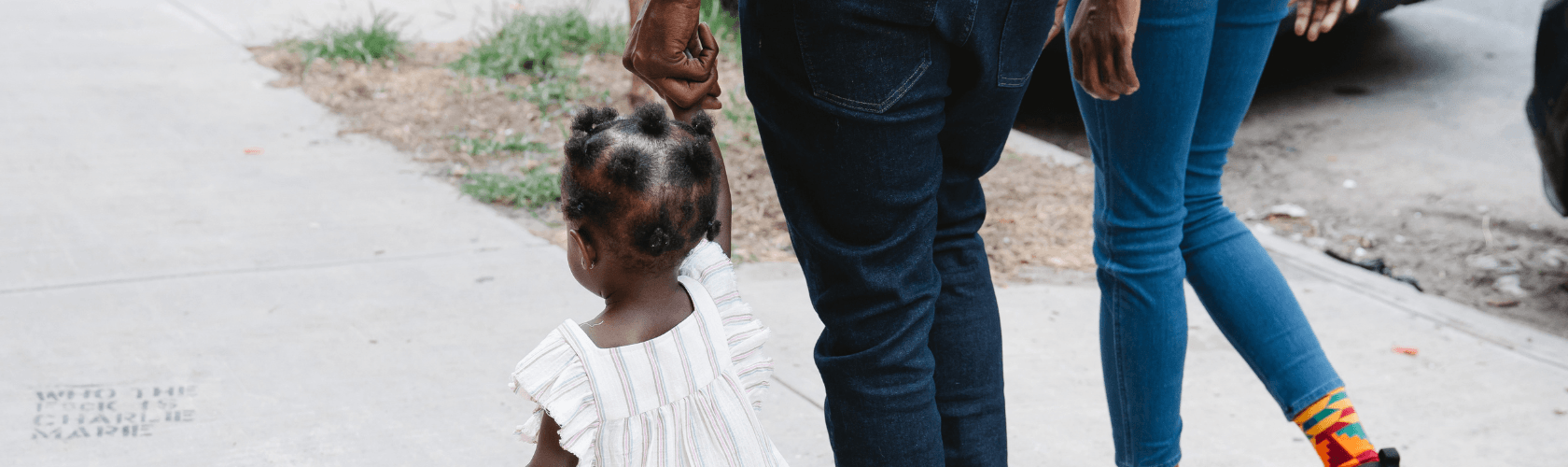 Woman walking with two kids