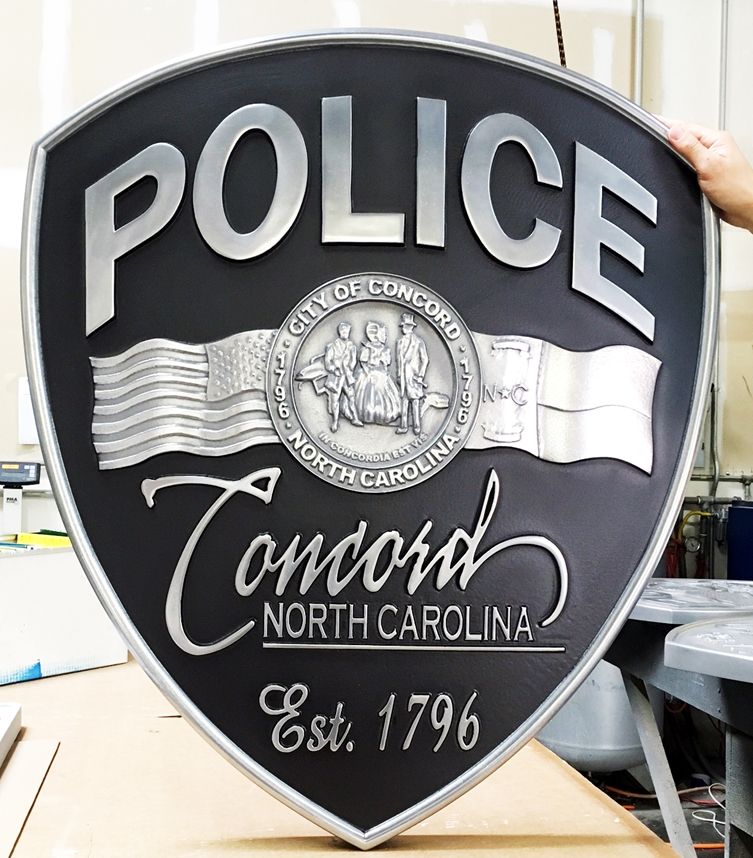 X33624 - 3-D Carved  Aluminum Metal-Coated Wall Plaque of the Shoulder Patch of the Police of Concord, NC  