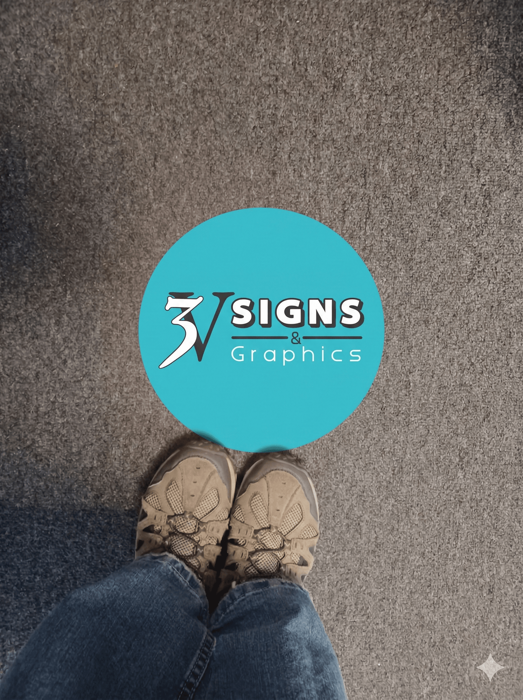 image of 3V logo ground graphic on the carpet at 3V Signs