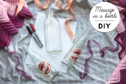 Supplies for a message in the bottle DIY project.