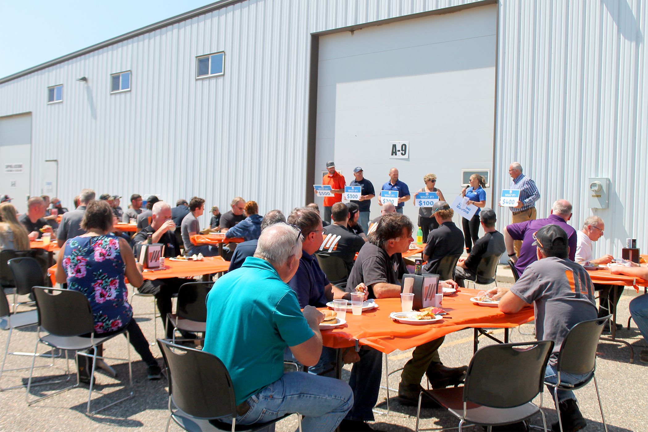 Executive Director Jen Jabas plays a game with Massman employees at their team picnic as part of their 2022 campaign. 