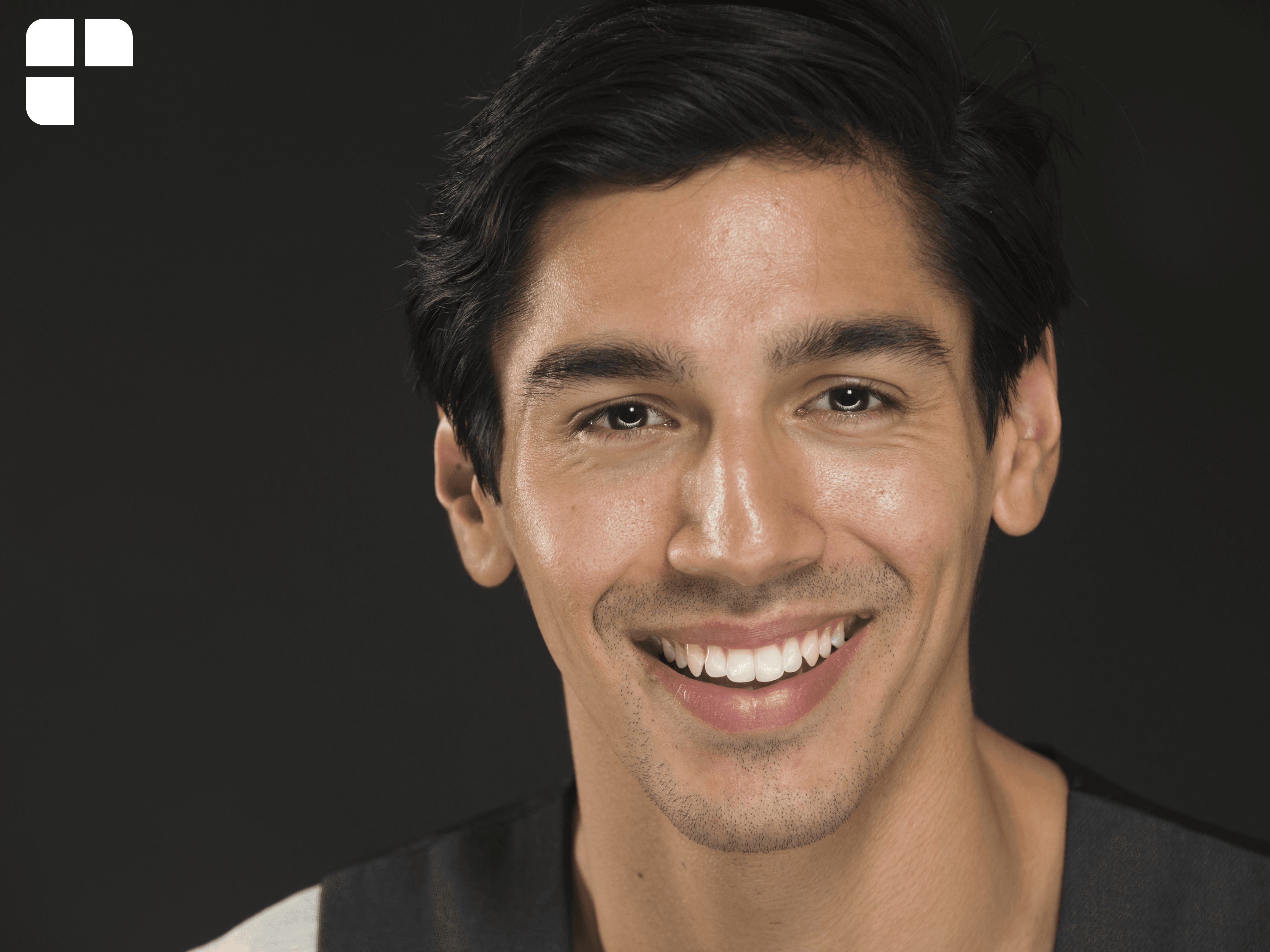 Picture of a teen boy smiling at the camera.