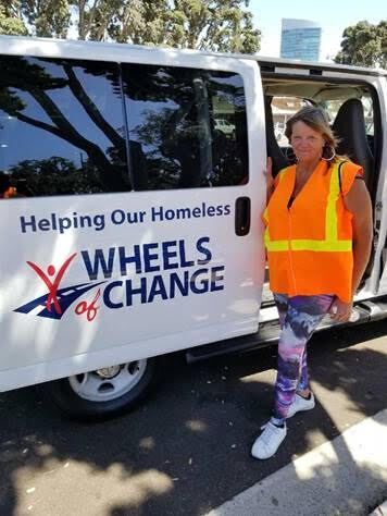 Volunteer by Wheels of Change van.