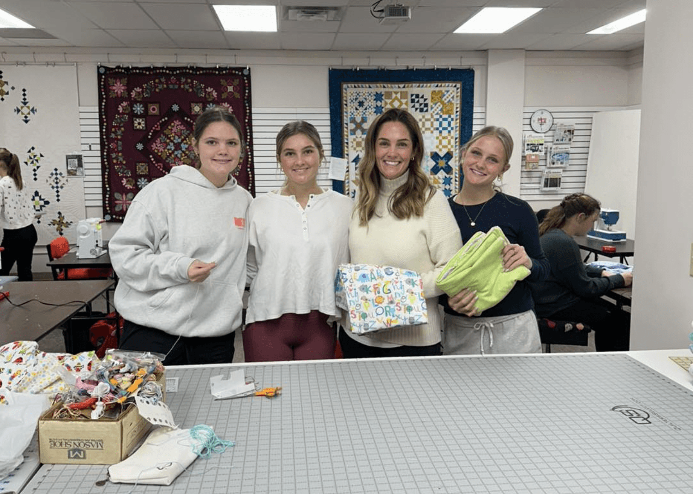 Mothers and Daughters Sewing Blankets