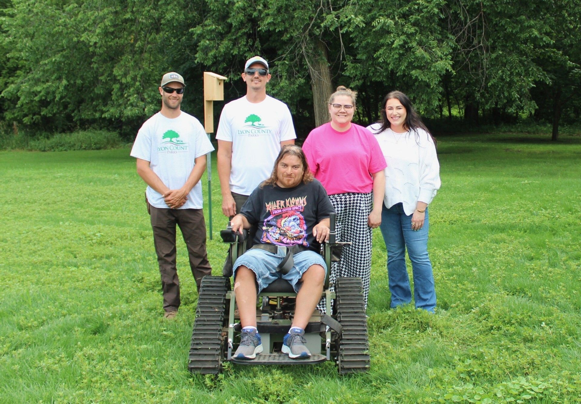 Aaron Valdez and Marshal Advance at Garvin Park putting up birdhouses with Lyon County Environmental Department