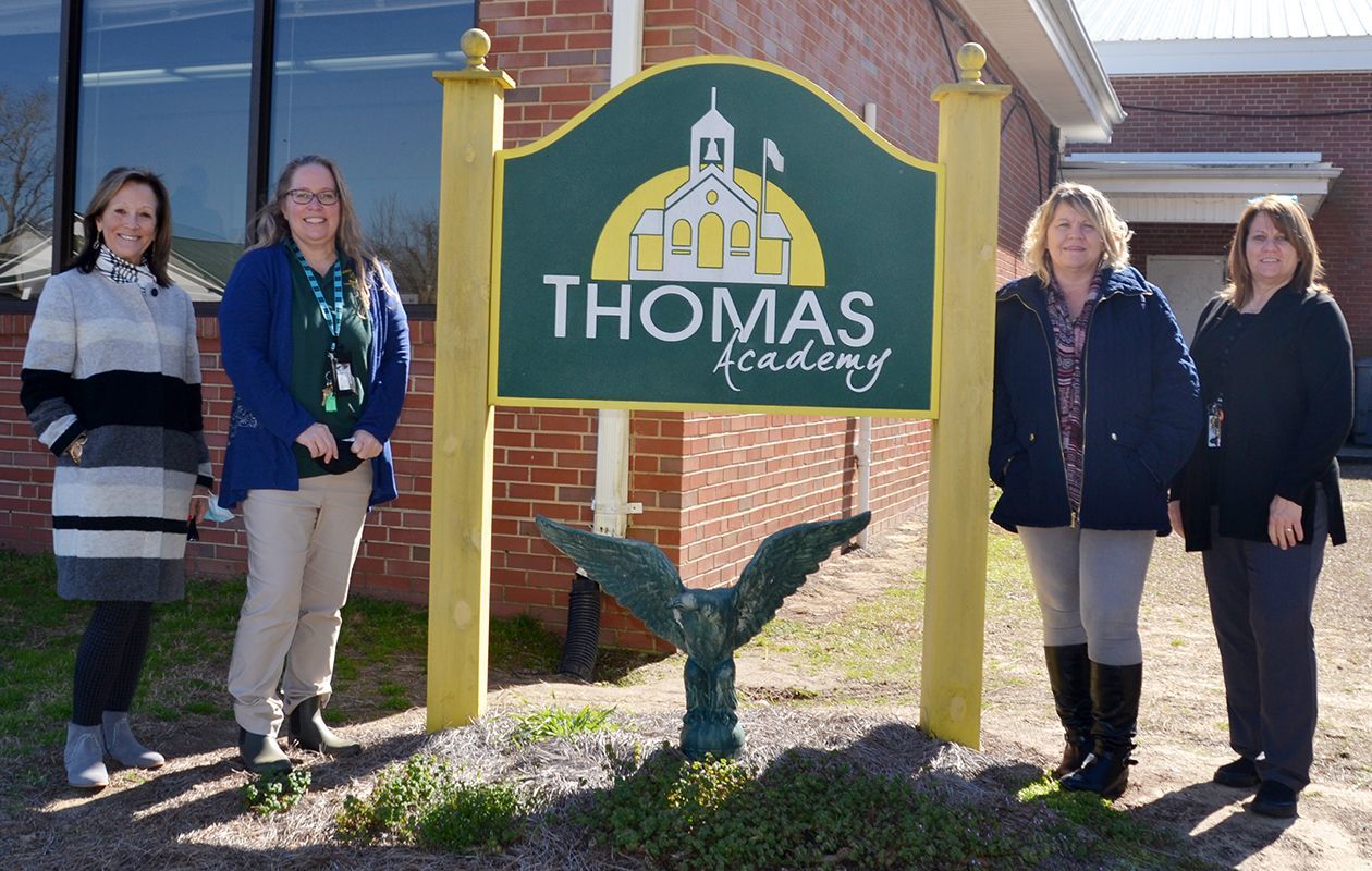 Thomas Academy Principal Dr. Cathy Gantz, left, and Academic Dean DeLayne Sons, right, took some time to recognize Instructional Coordinator Sherry Kennedy, second from left, and Mental Health Counselor Teresa Hunt during National School Counselor Week.