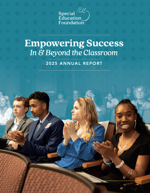 students sitting in chairs clapping