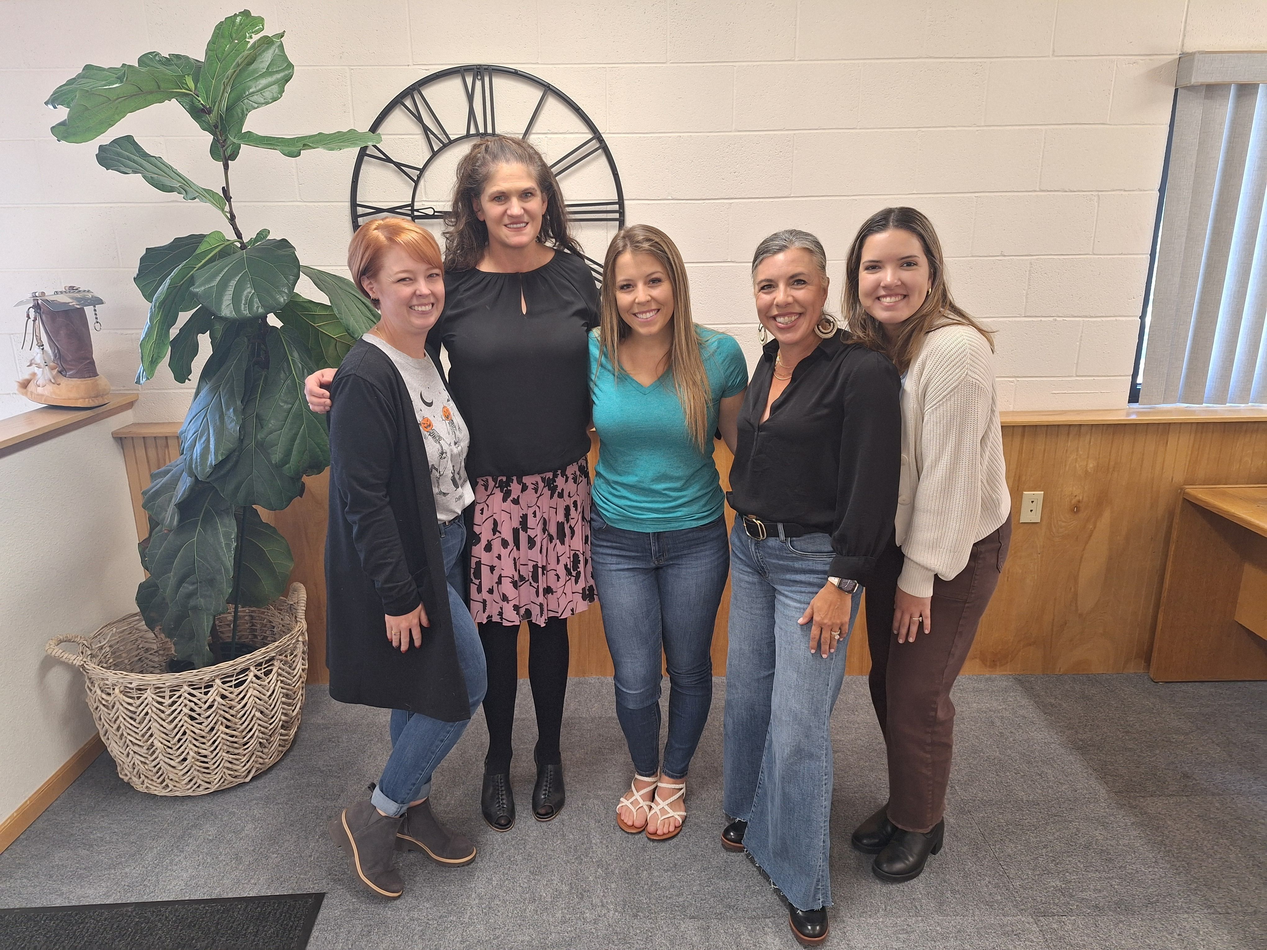 Addison at her closing with the Berthoud habitat staff.