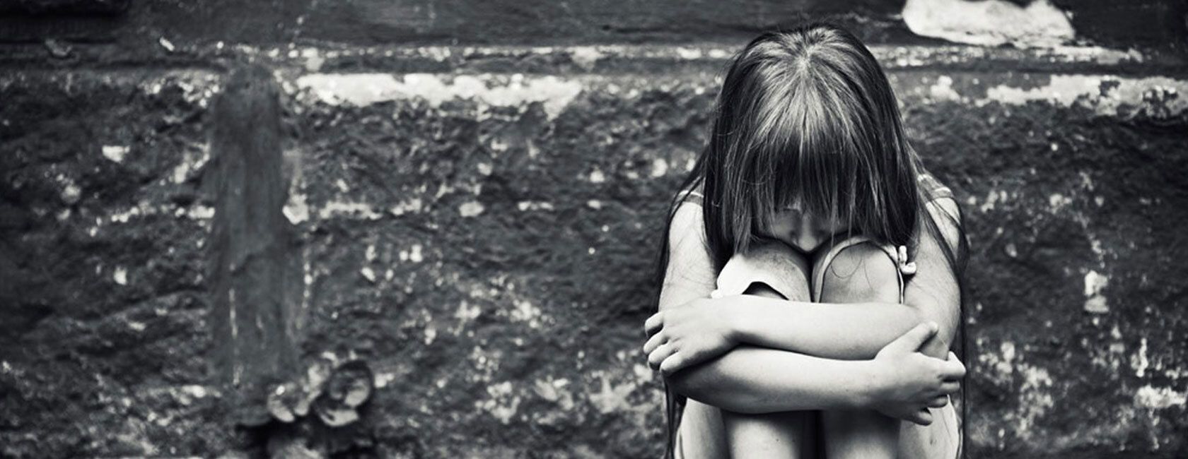 Young girl sitting outside