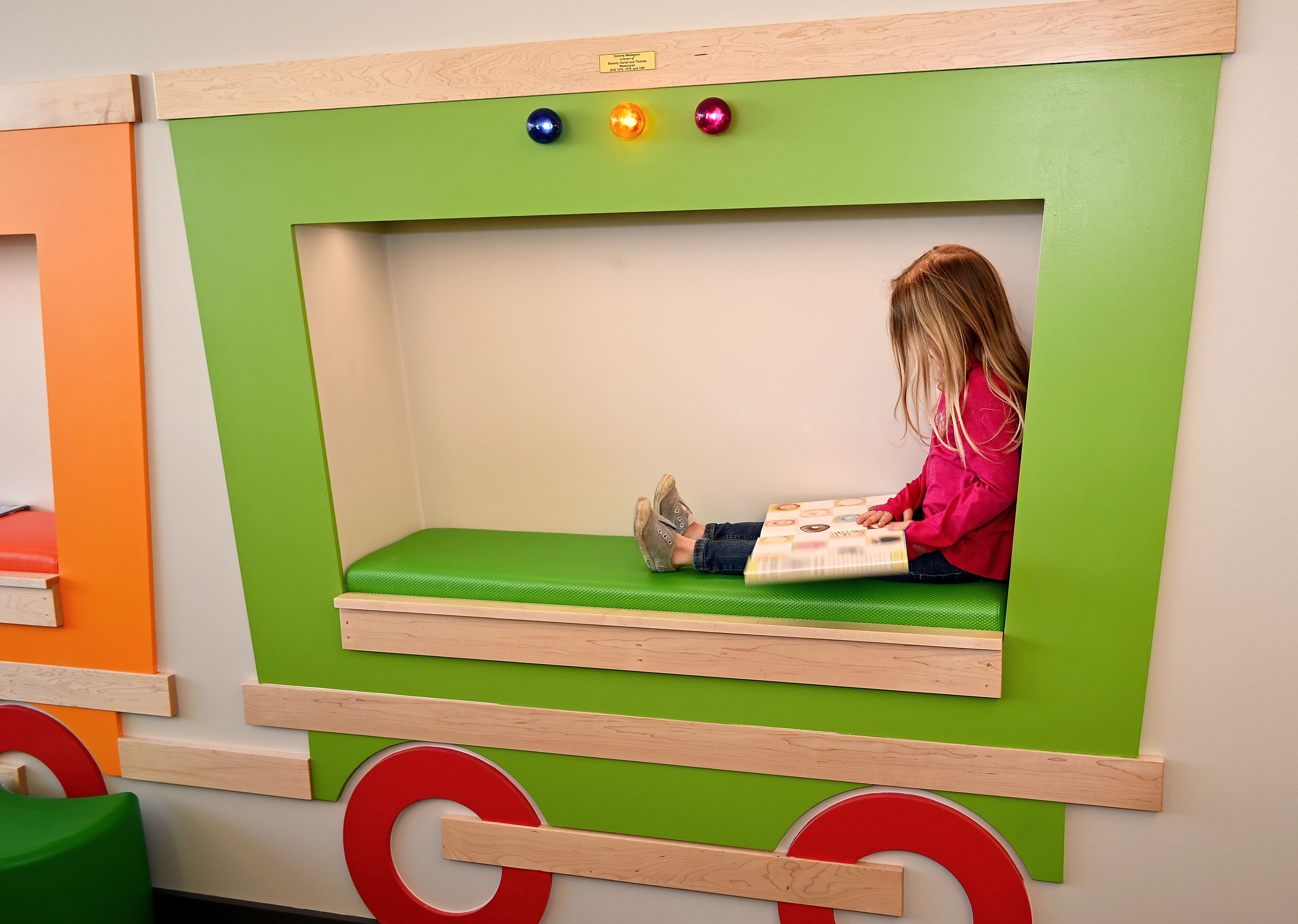 child in train cubby