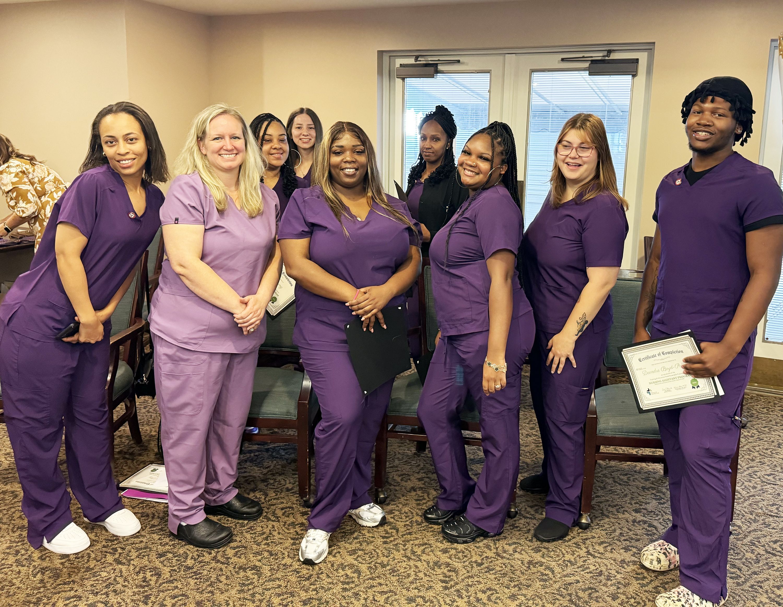 NATC Grads & Instructor (from left): Amanda Clay, nurse aide instructor Katrina Allard, RN, BSN, Amber Young, Kyla Yost, Precious Green, Joy Watkins, Sharon Brown, Matilda Wagle, and Deondre Boyd-Pollard. Not pictured: Byra Hudson. 