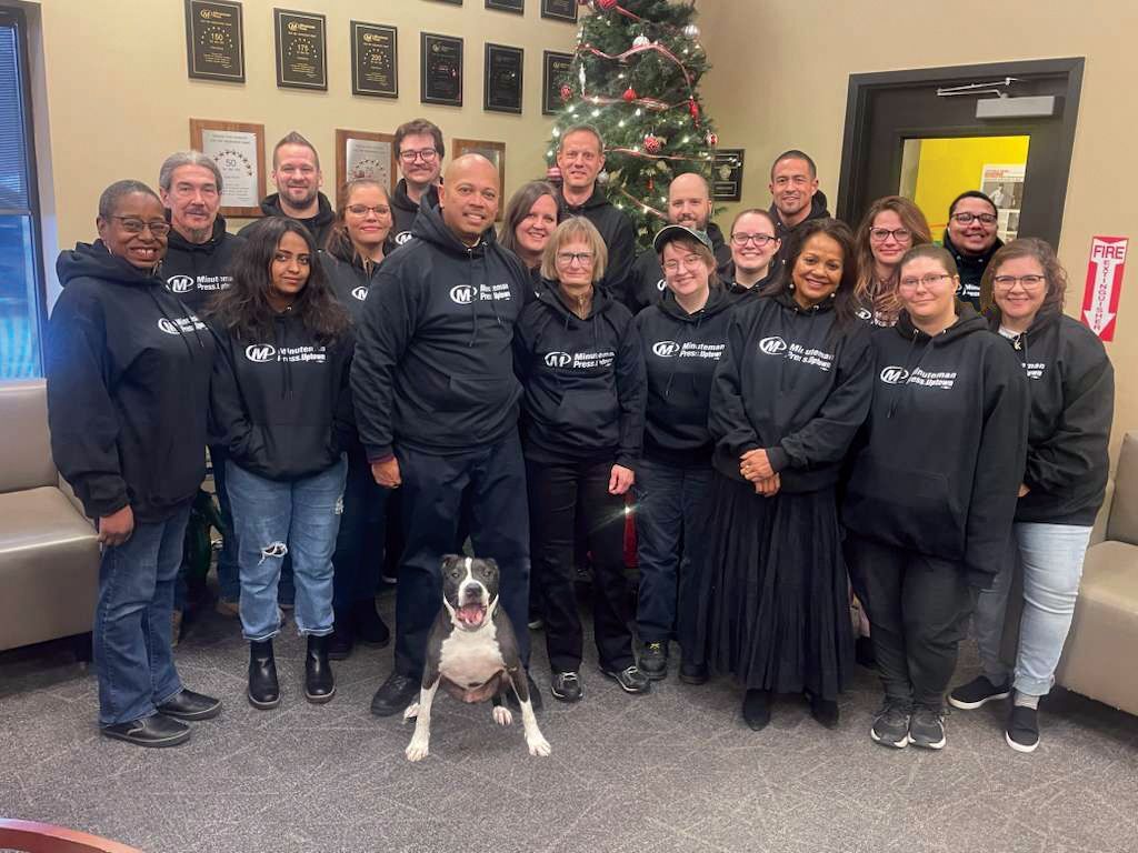 Minuteman Press Uptown employees celebrating Christmas and the Holiday season