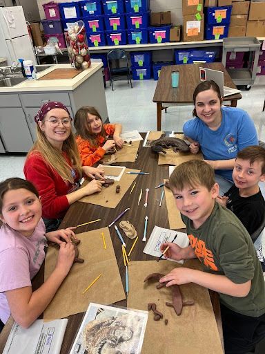 Facilitators and students enjoy creating their Hellbender sculptures