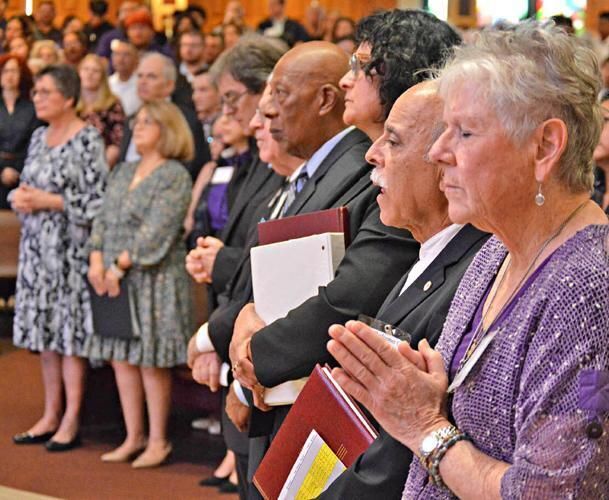 Those involved in faith formation programs pray for their catechumens and candidates at the February Rite of Election Masses