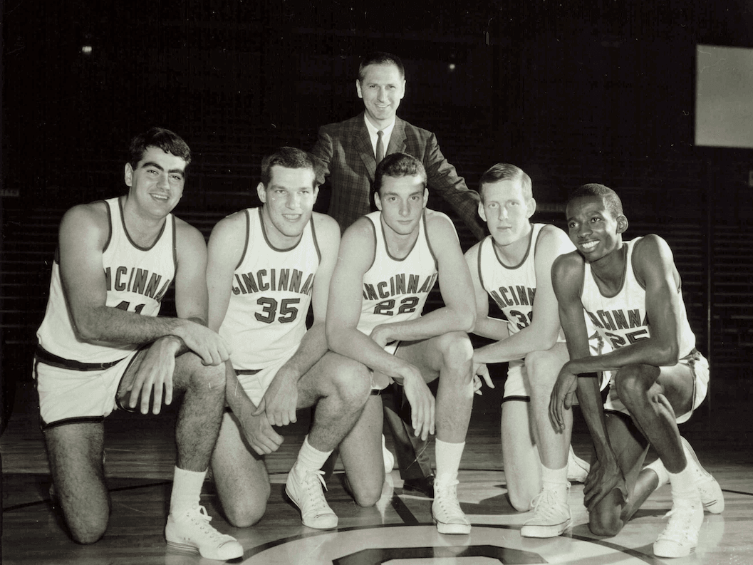 Dean Lampros, Tom Biedenharn, Ron Krick, Don Rolfs, Roland West. Standing: Coach Tay Baker