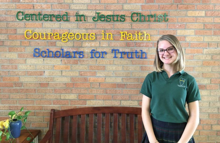 She wasn’t Catholic when she started going to Catholic school. Now she and five others are.