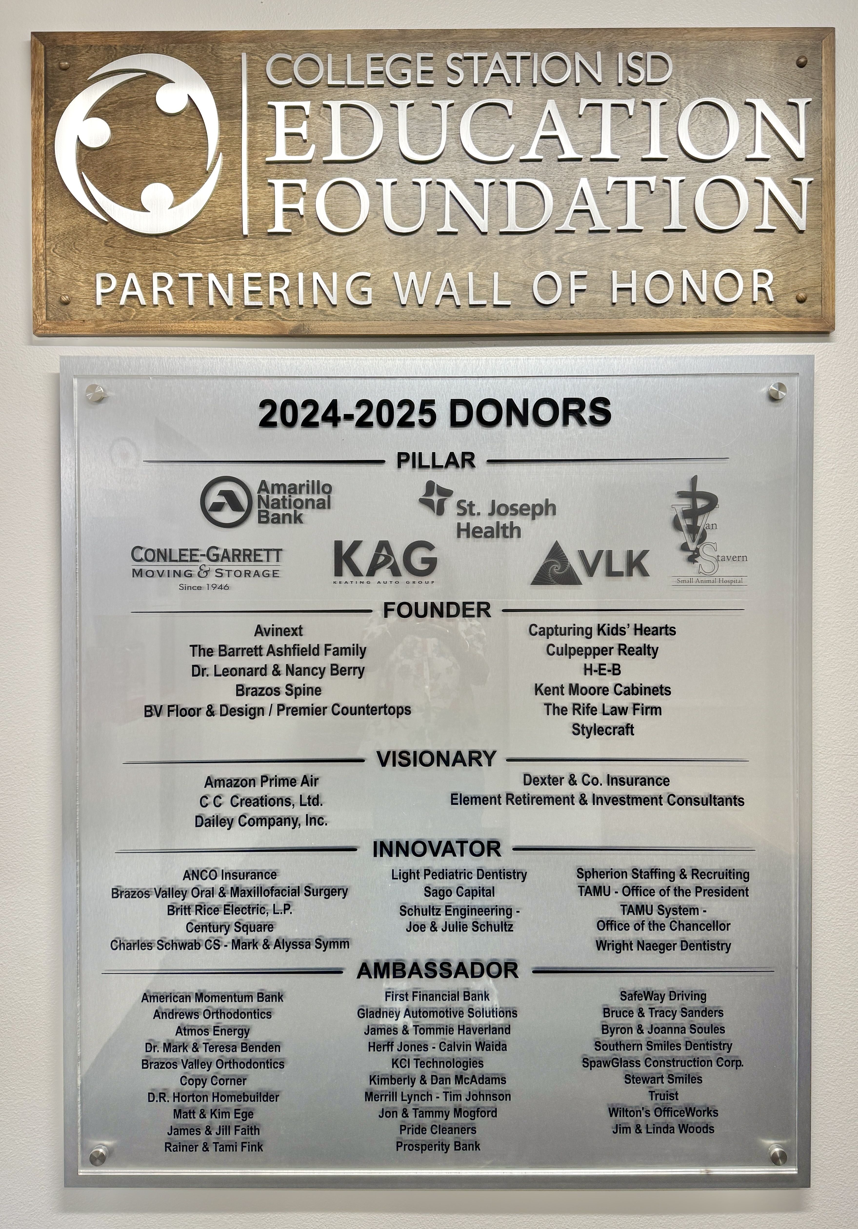 Donor wall with Education Foundation partner names and logos