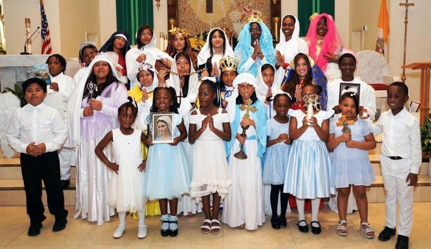 Children portrayed important Catholic figures during the Marian concert at Sacred heart in Lake Worth Beach.