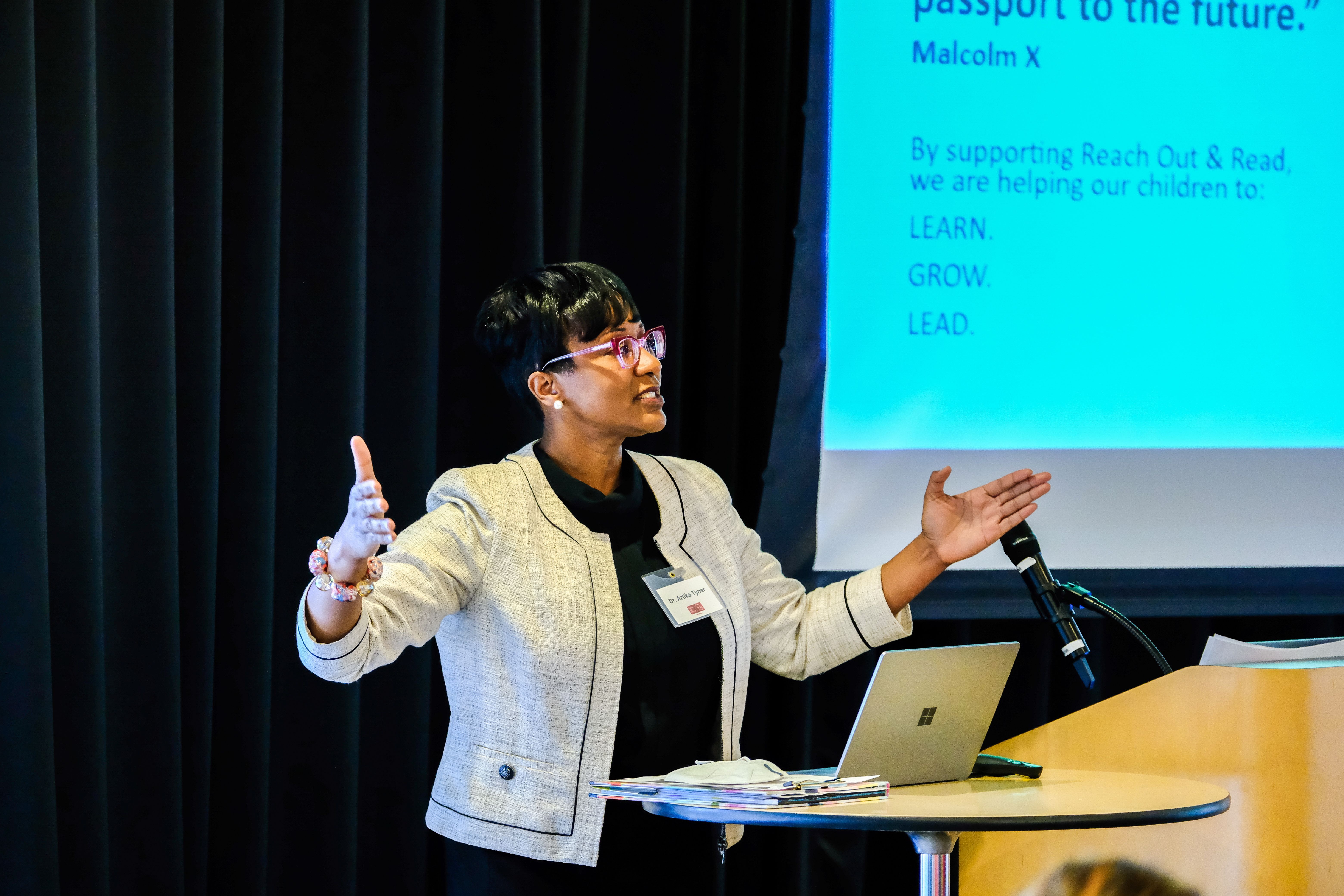 Dr. Artika Tyner speaks at podium