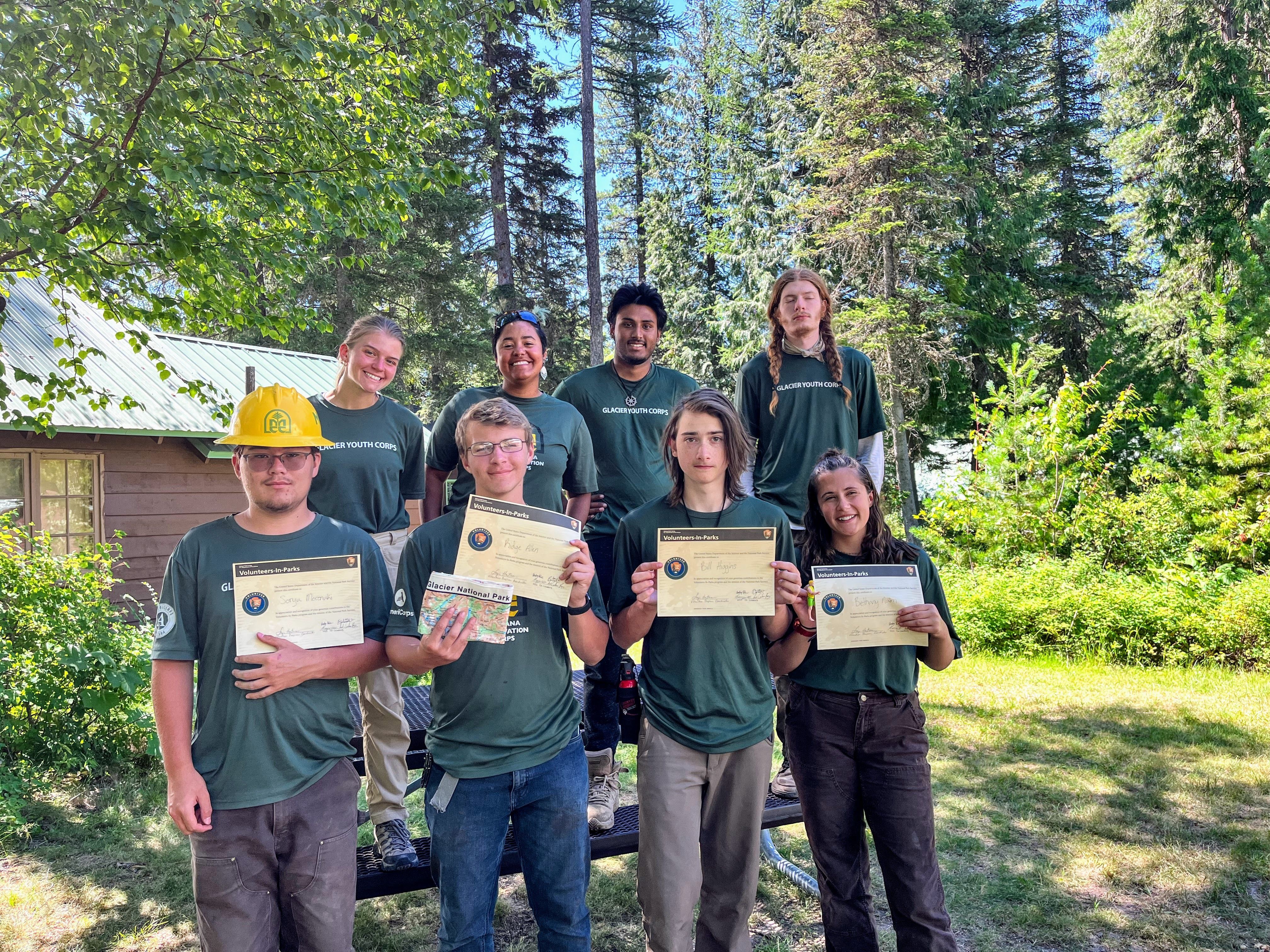 The crew poses with their certificates of completion.
