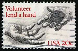 Old looking stamp with two hands reaching each other