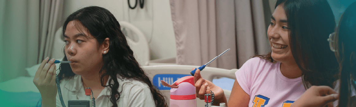 nursing student taking temperature and smiling