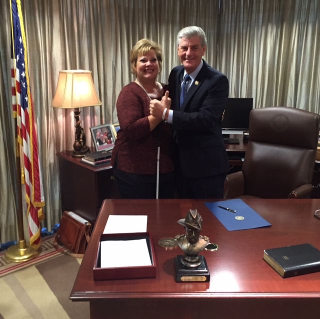 Picture of Danay and Mississippi's Governor Phil Bryant.