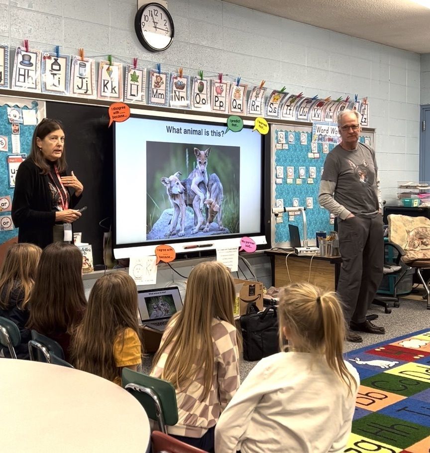 Loti Woods and Dale Weiler teaching students about Red Wolves