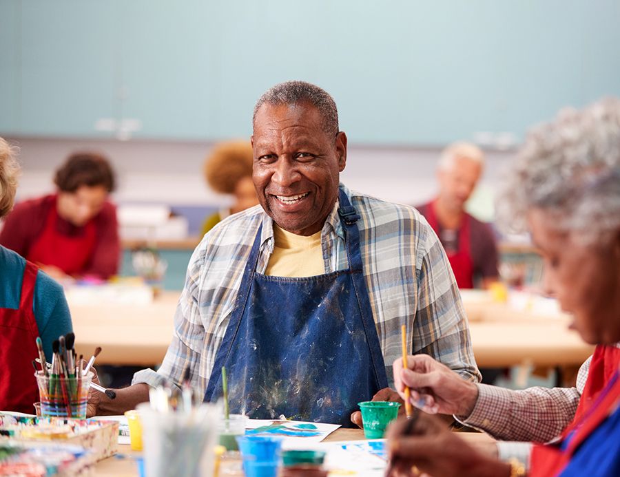 African American male, senior, smiling in art class