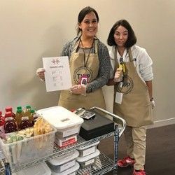 Employee and consumer working the snack cart