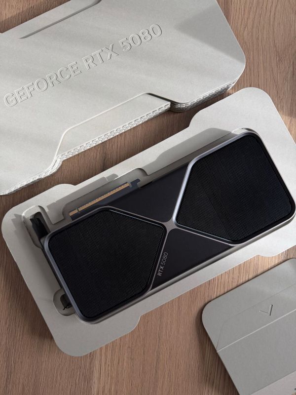 GeForce RTX 5080 graphics card nestled in molded gray foam packaging, an example of best unboxing experiences in premium tech hardware.