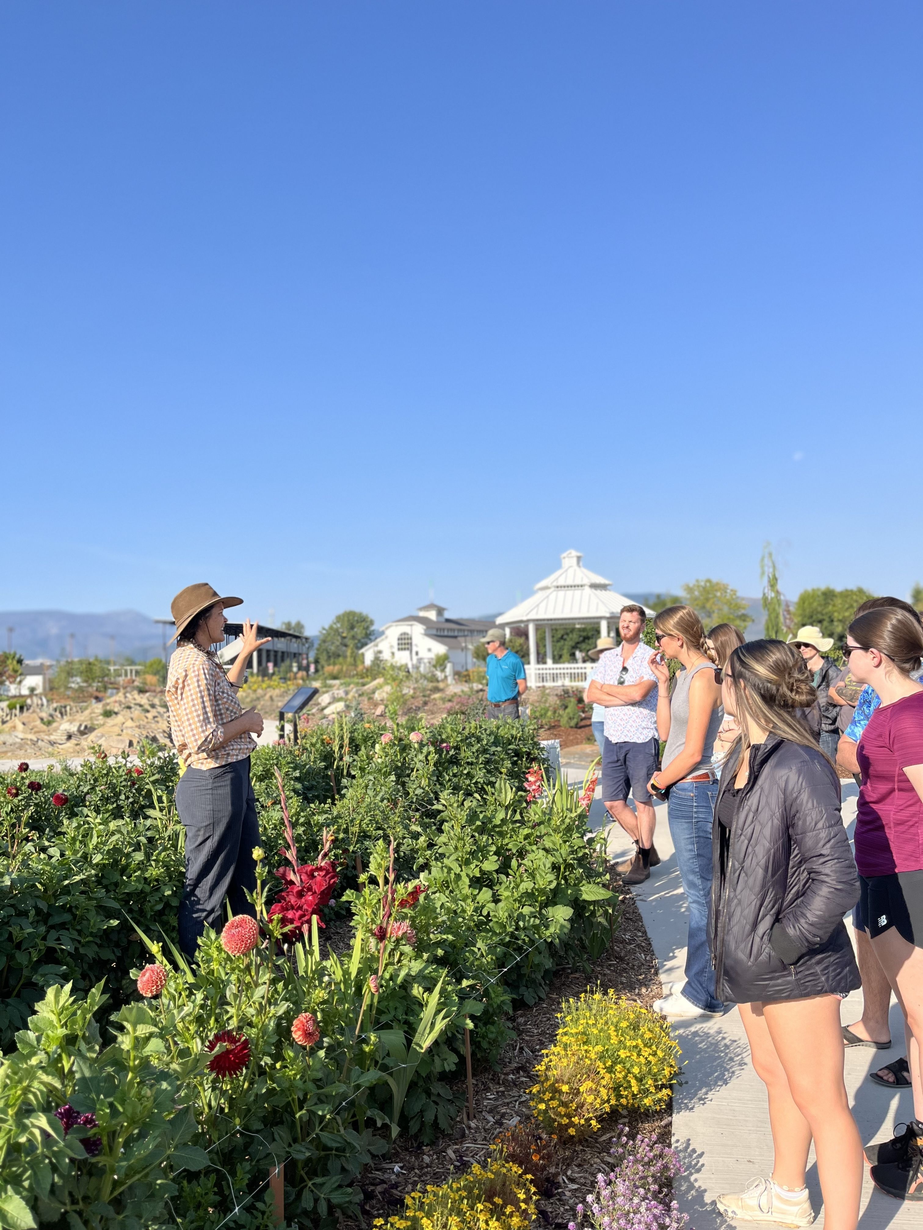 Molly Anton, RMG Coordinator, speaks to a group touring the gardens.