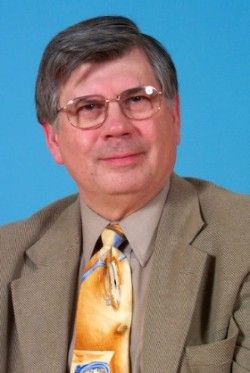 A picture of William Kimberling in front of a blue background