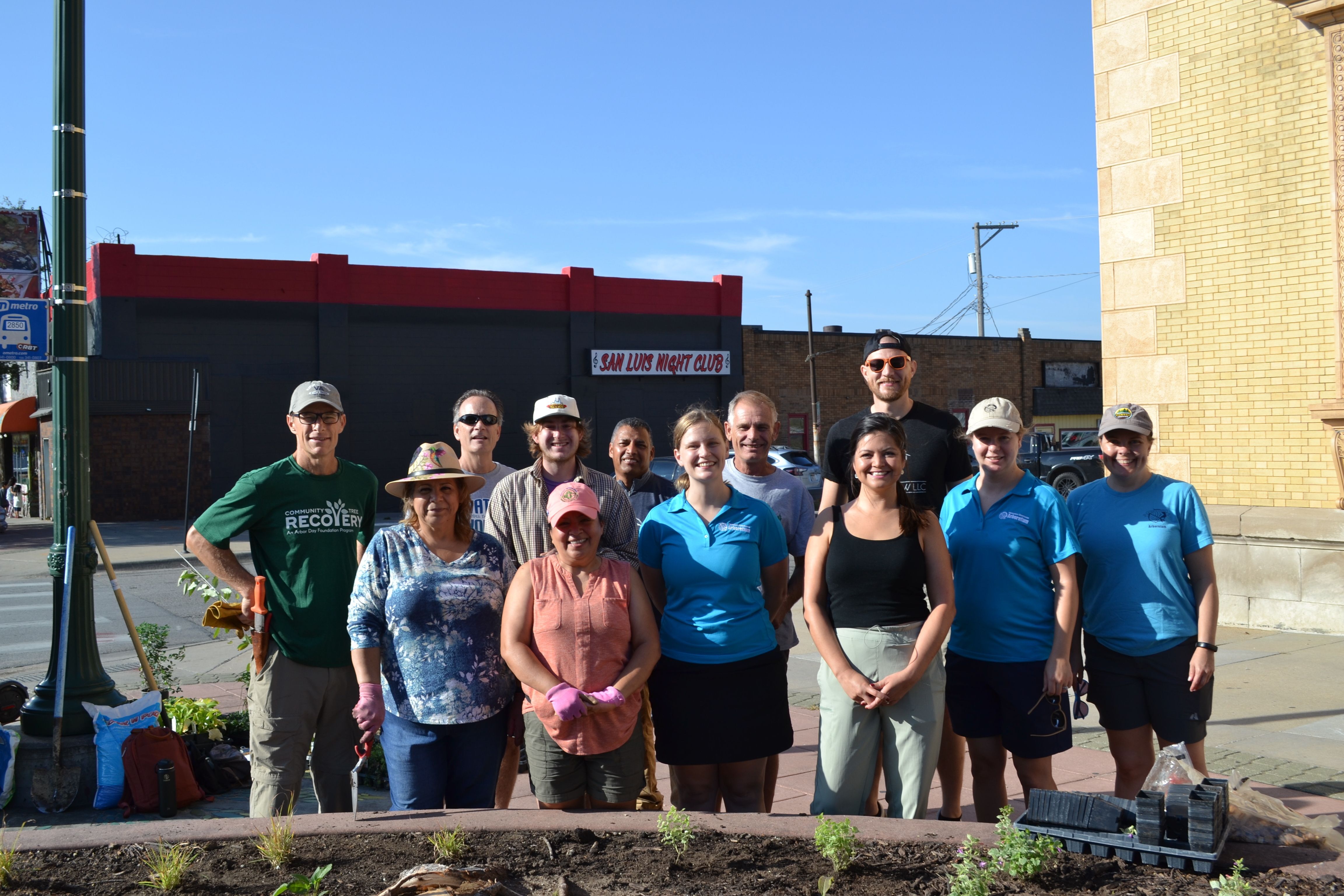 Community leaders, volunteers and Nebraska Statewide Arboretum participate in a planting for the South Omaha Business Improvement District. 